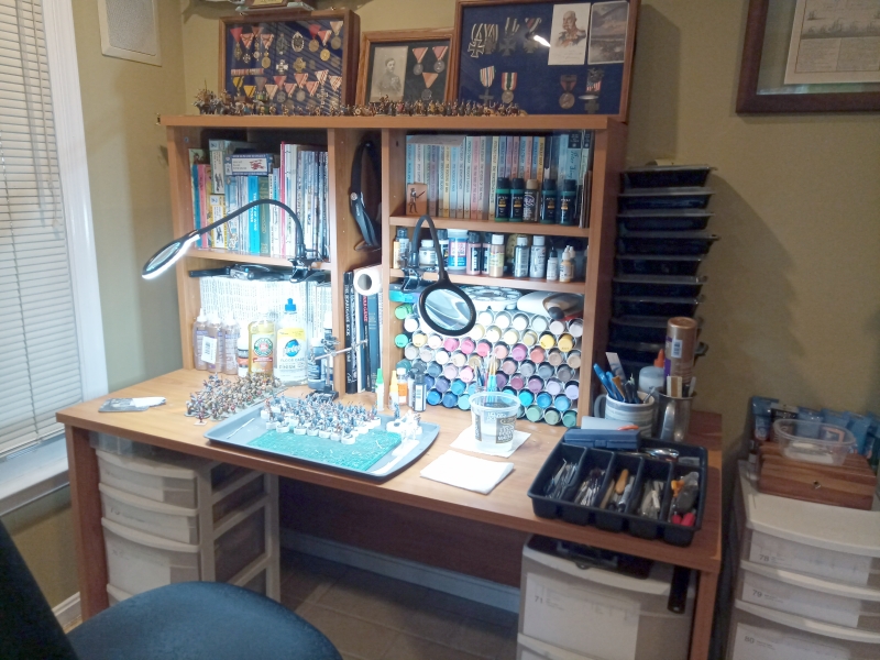 A well lit painting desk